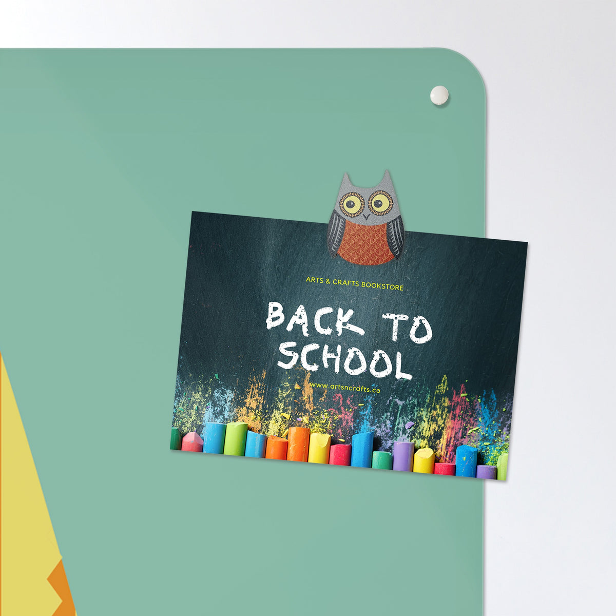 A postcard held by a fridge magnet on the Wise Owl Number Square magnetic notice board in Wise Owl Number Square