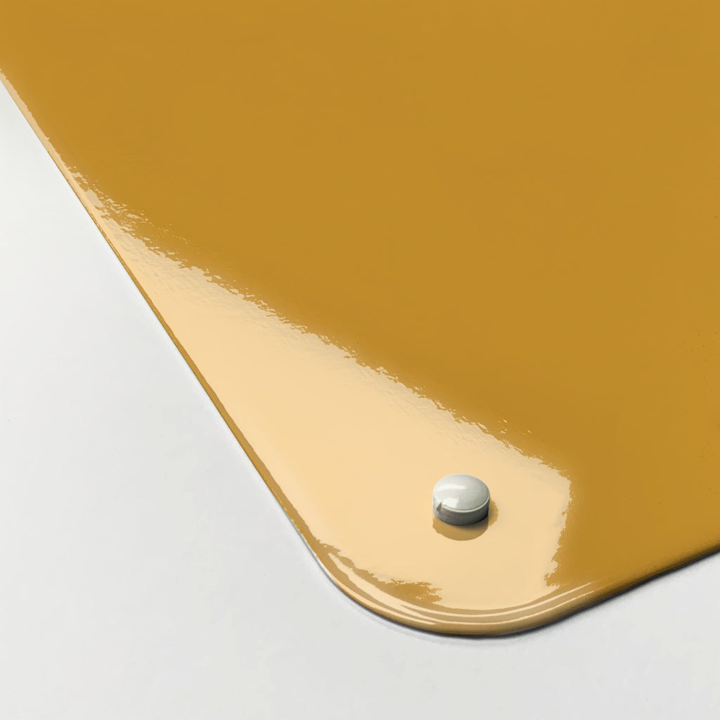 Close-up of the corner of the Wise Owl Times Tables magnetic notice board in 'Wise Owl - Times Tables', showing the gloss finish and a screw cap