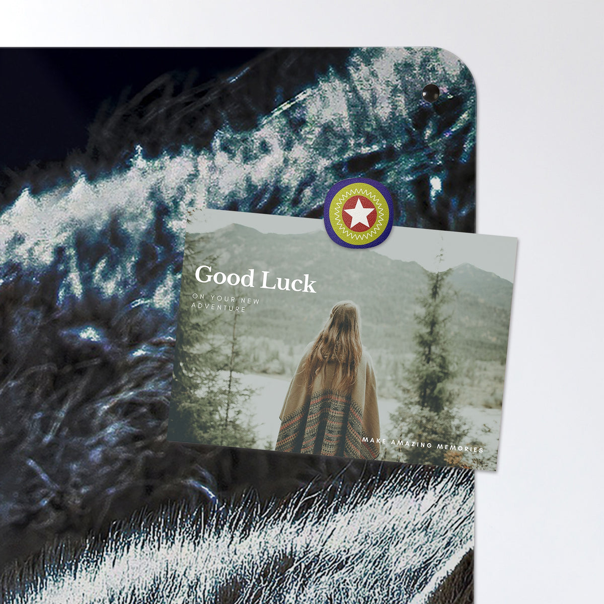 A postcard held by a fridge magnet on the Wolves Under The Moon magnetic notice board