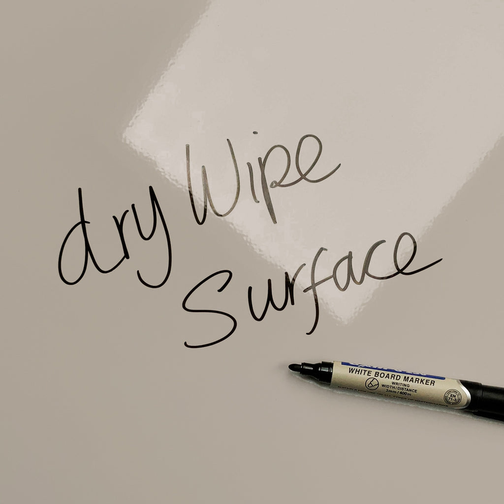 The words dry wipe surface written in marker pen on the Wood Cladding magnetic notice board
