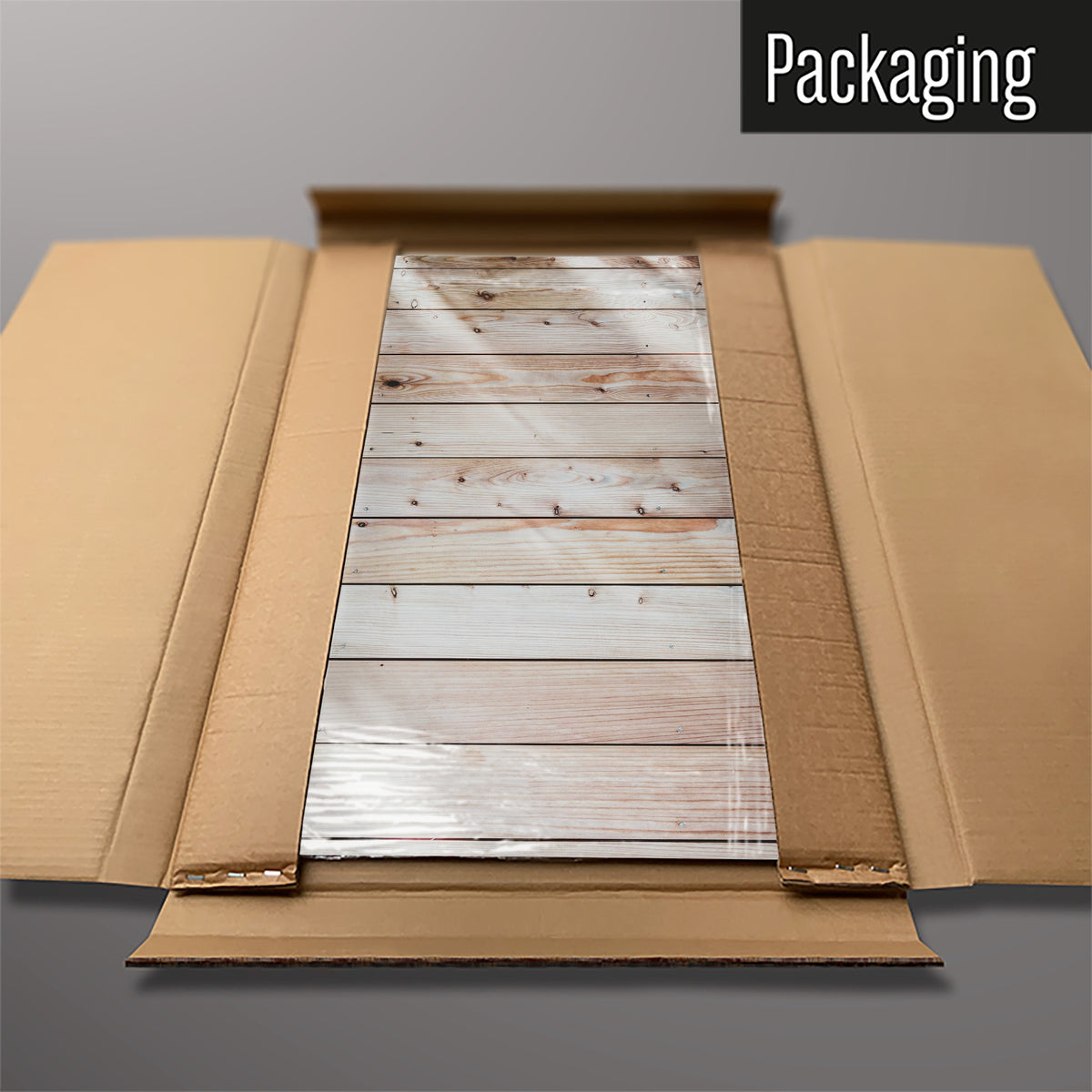 The Wood Cladding magnetic notice board packed flat in its cardboard box