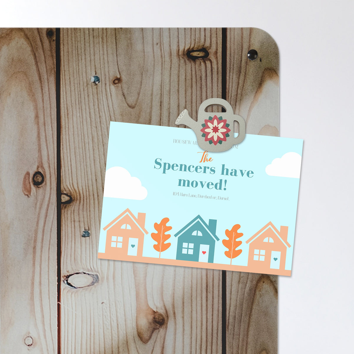 A postcard held by a fridge magnet on the Wood Cladding magnetic notice board