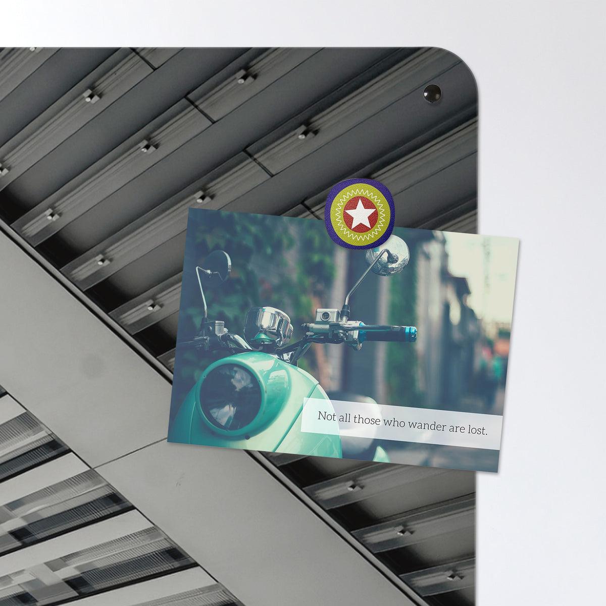 A postcard held by a fridge magnet on the Zurich Skyscrapers magnetic notice board
