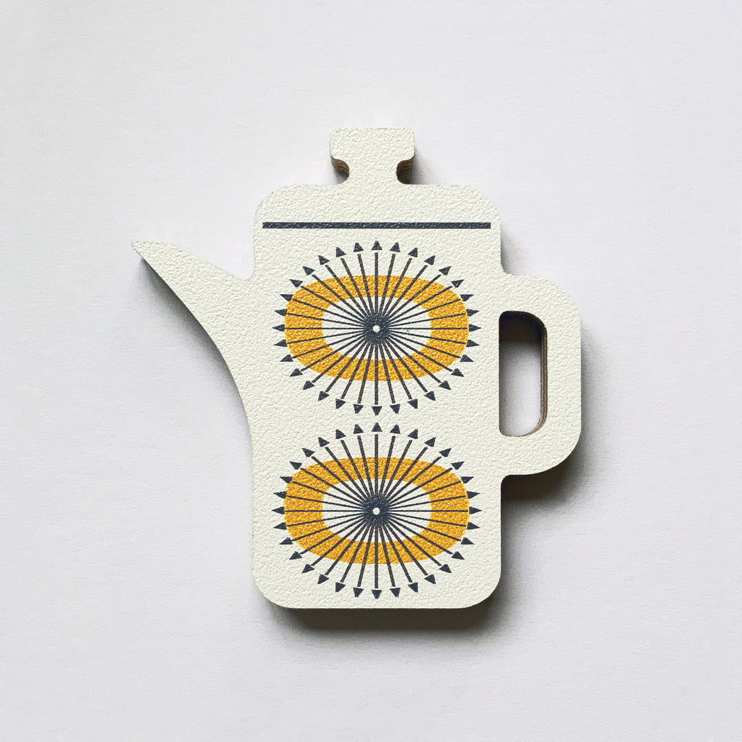 A white coffee pot shaped plywood fridge magnet by Beyond the Fridge