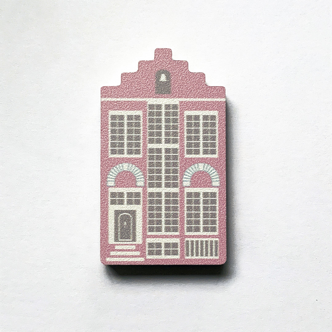 A pink Delft house shaped plywood fridge magnet by Beyond the Fridge