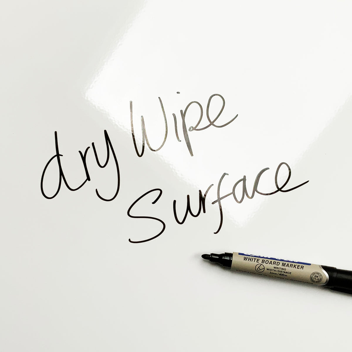 Close-up of the dry wipe finish on the Jelly Beans magnetic board, with “dry wipe surface” written in marker