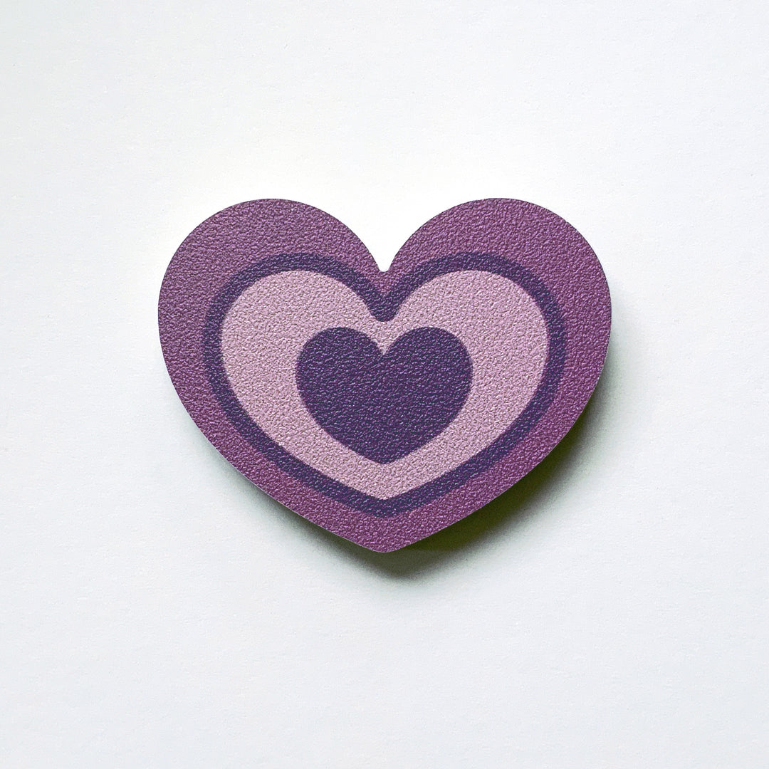 A purple heart shaped plywood fridge magnet by Beyond the Fridge