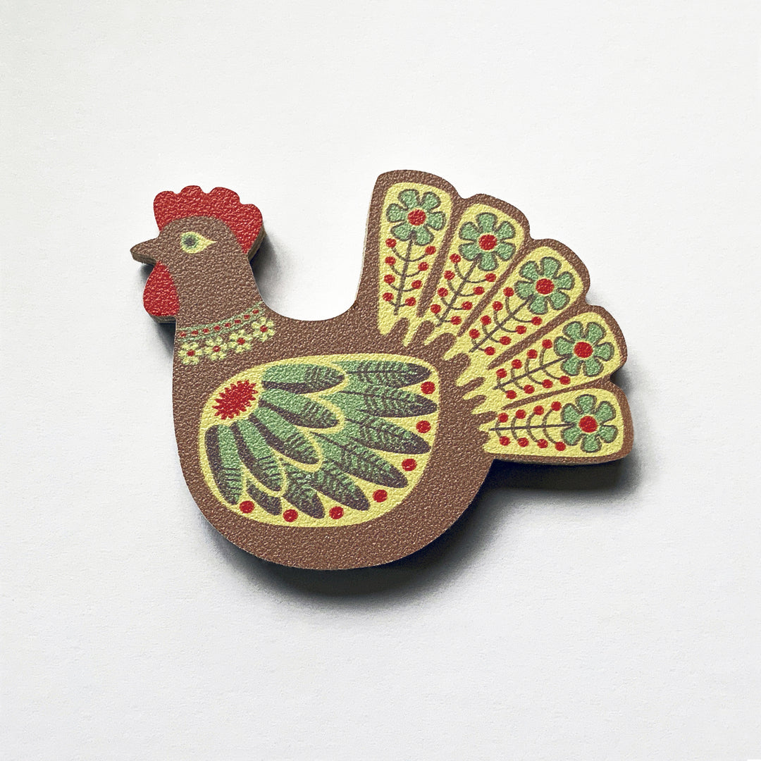 A brown hen shaped plywood fridge magnet by Beyond the Fridge