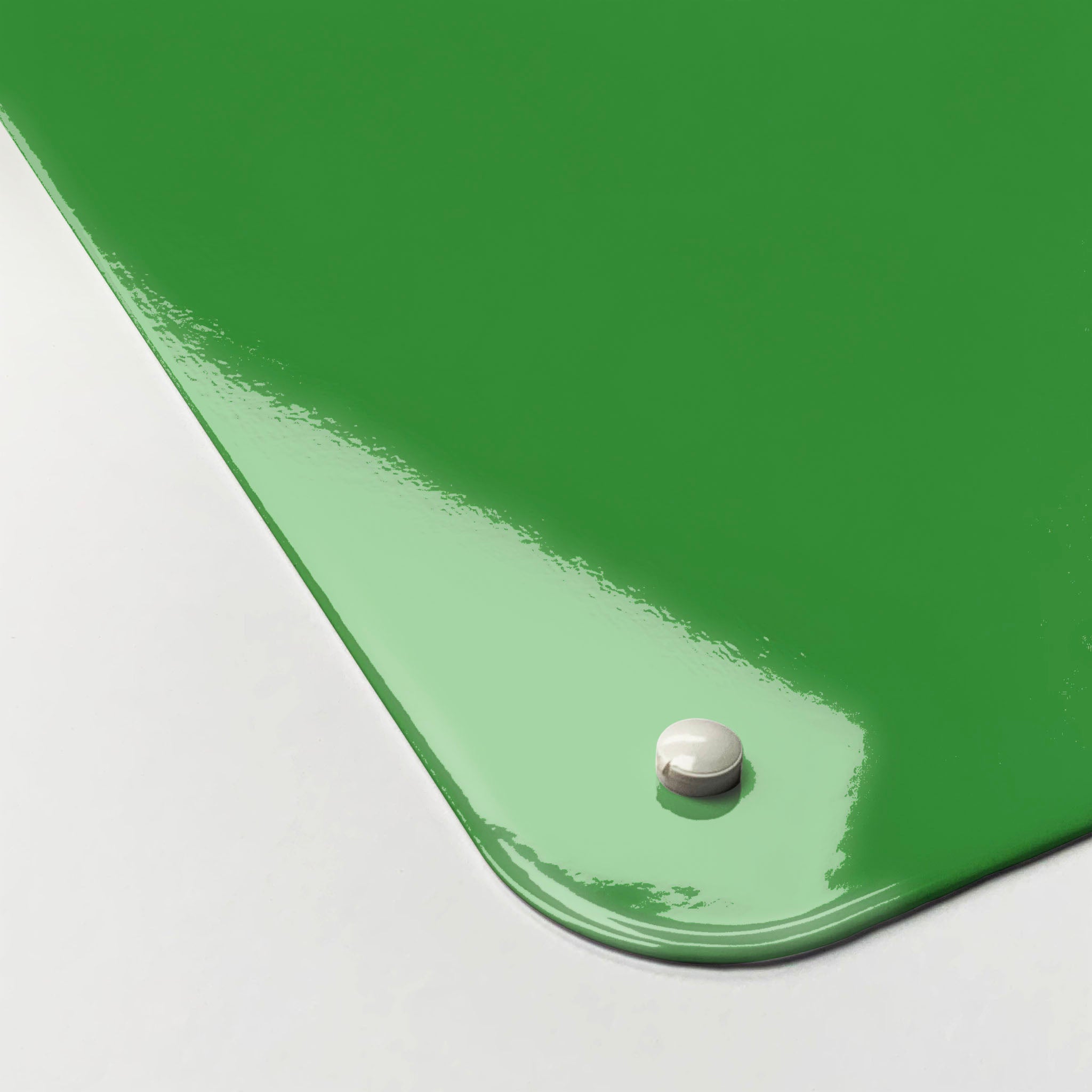 The corner detail of a green keep calm and carry on magnetic board to show it’s high gloss surface
