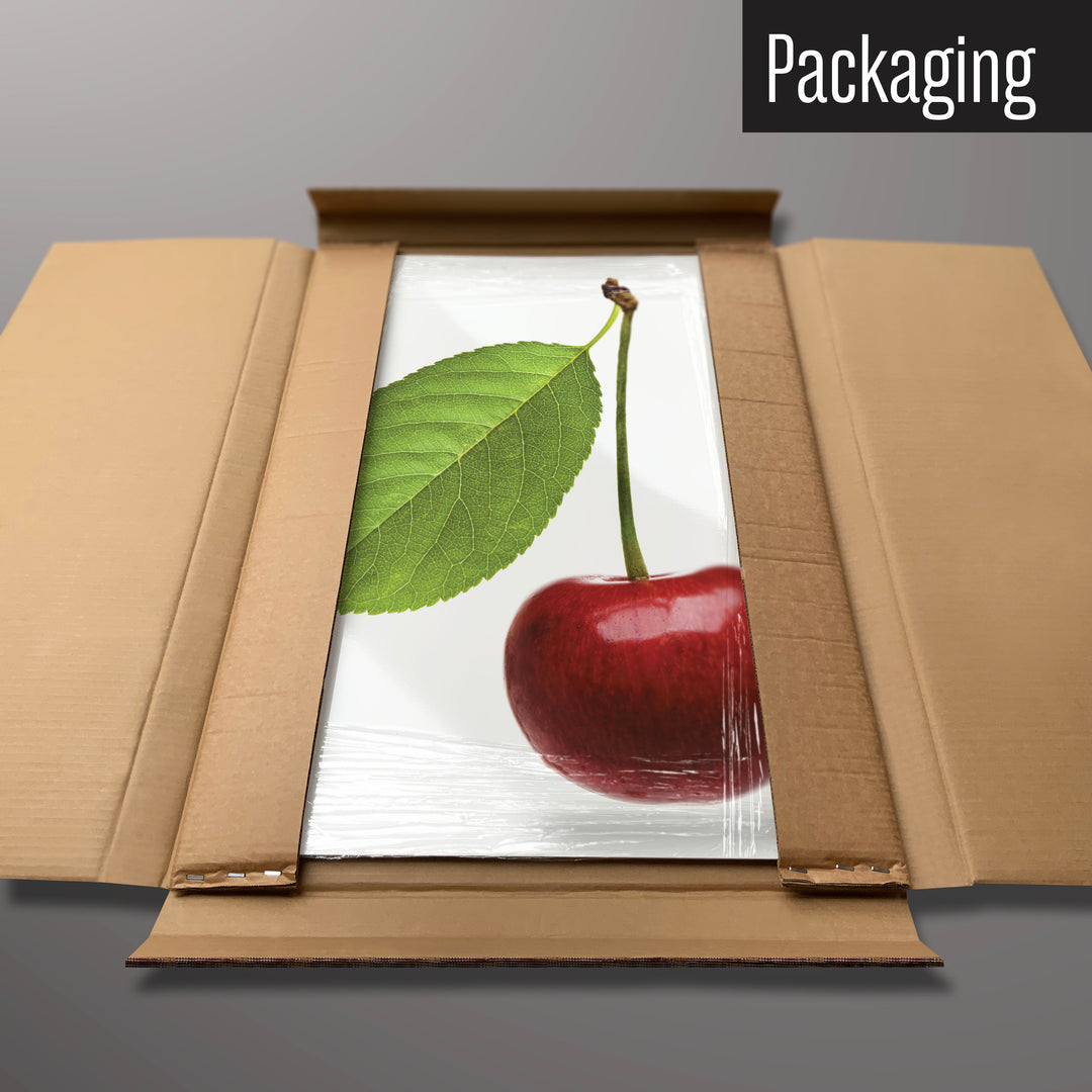 A cherry photographic magnetic board in it’s cardboard packaging
