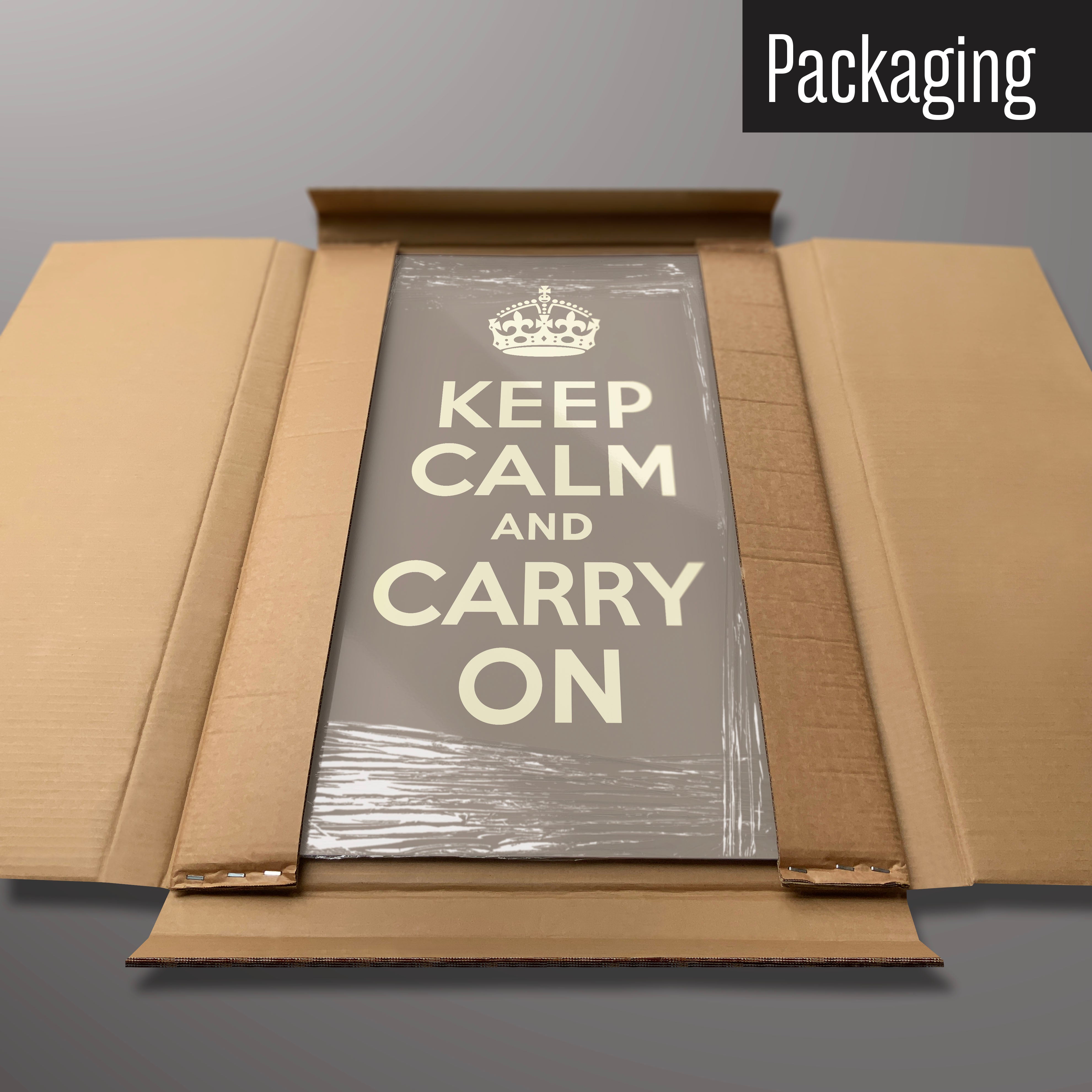 A brown keep calm and carry on magnetic board in it’s cardboard packaging
