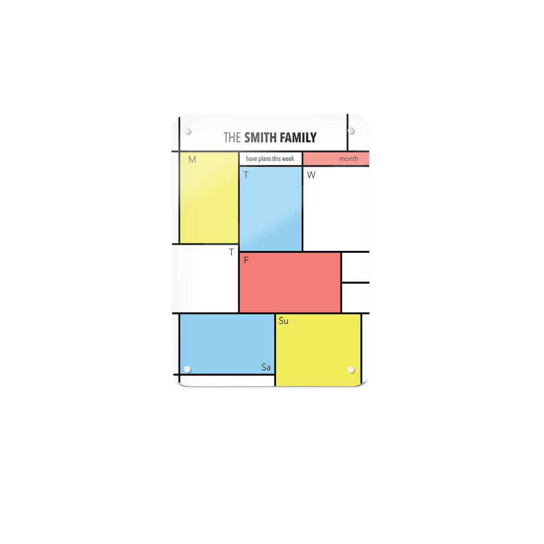 A small magnetic notice board by Beyond the Fridge with a Piet Mondrian design weekly planner to personalise in a portrait format