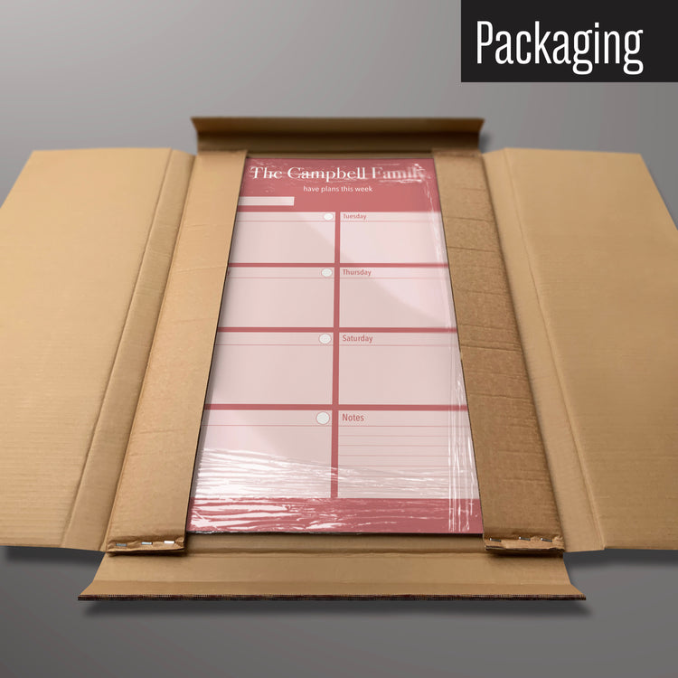 A pink weekly planner to personalise design magnetic board in it’s cardboard packaging