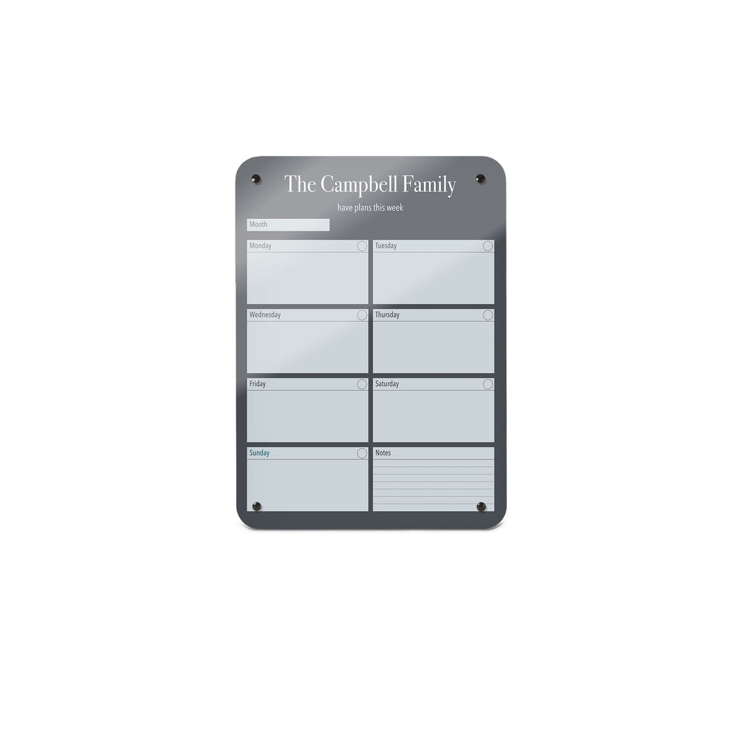 A small magnetic notice board by Beyond the Fridge with a weekly planner design to personalise  in a grey colour and portrait format 