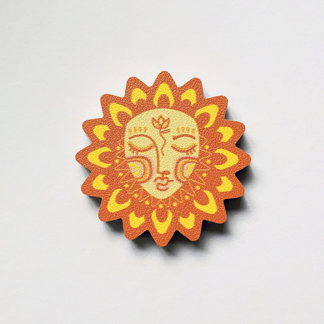 A sun shaped plywood fridge magnet by Beyond the Fridge