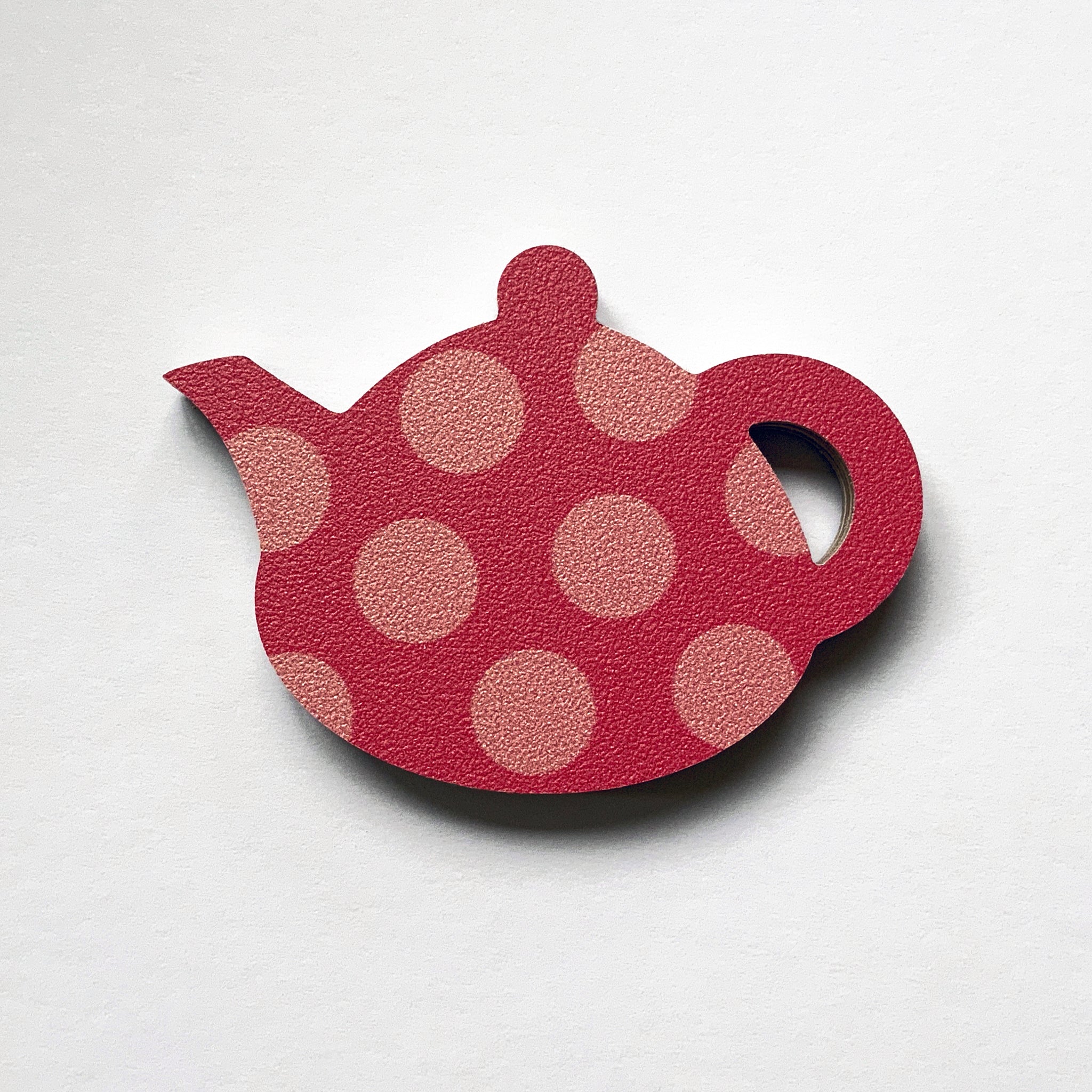 A pink teapot shaped plywood fridge magnet by Beyond the Fridge