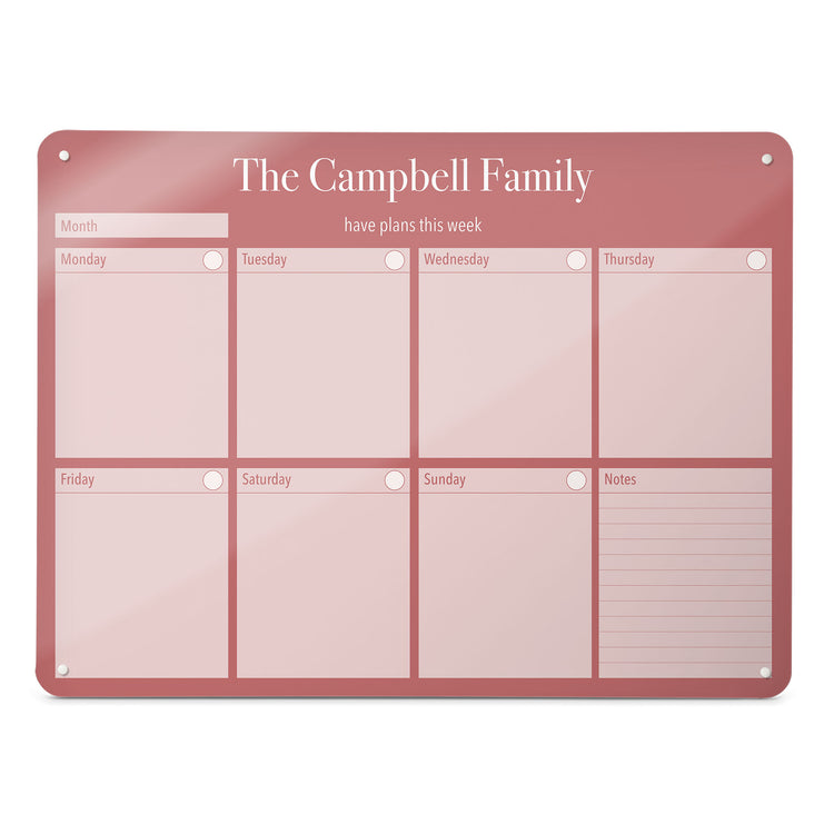 A large magnetic notice board by Beyond the Fridge with a weekly planner design to personalise  in a pink colour and landscape format 