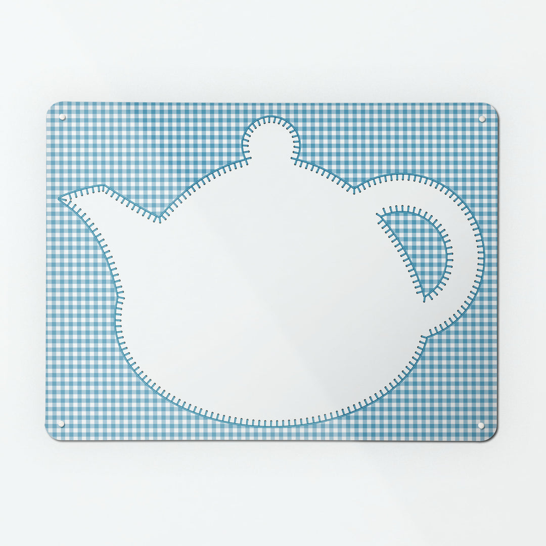 A large magnetic notice board by Beyond the Fridge with an appliqué teapot design in white on a blue gingham background