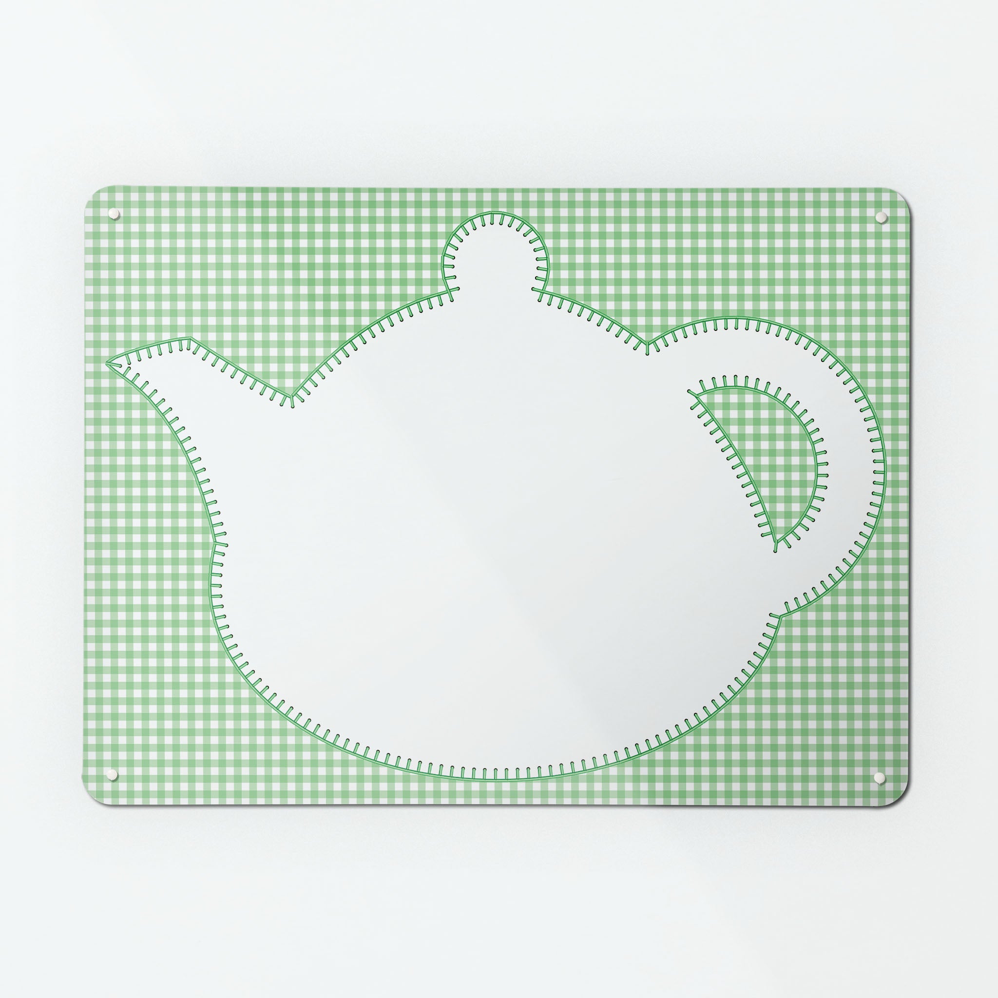 A large magnetic notice board  with an appliqué teapot design in white on a green gingham background