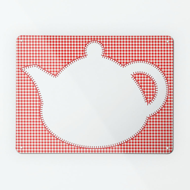 A large magnetic notice board  with an appliqué teapot design in white on a red gingham background