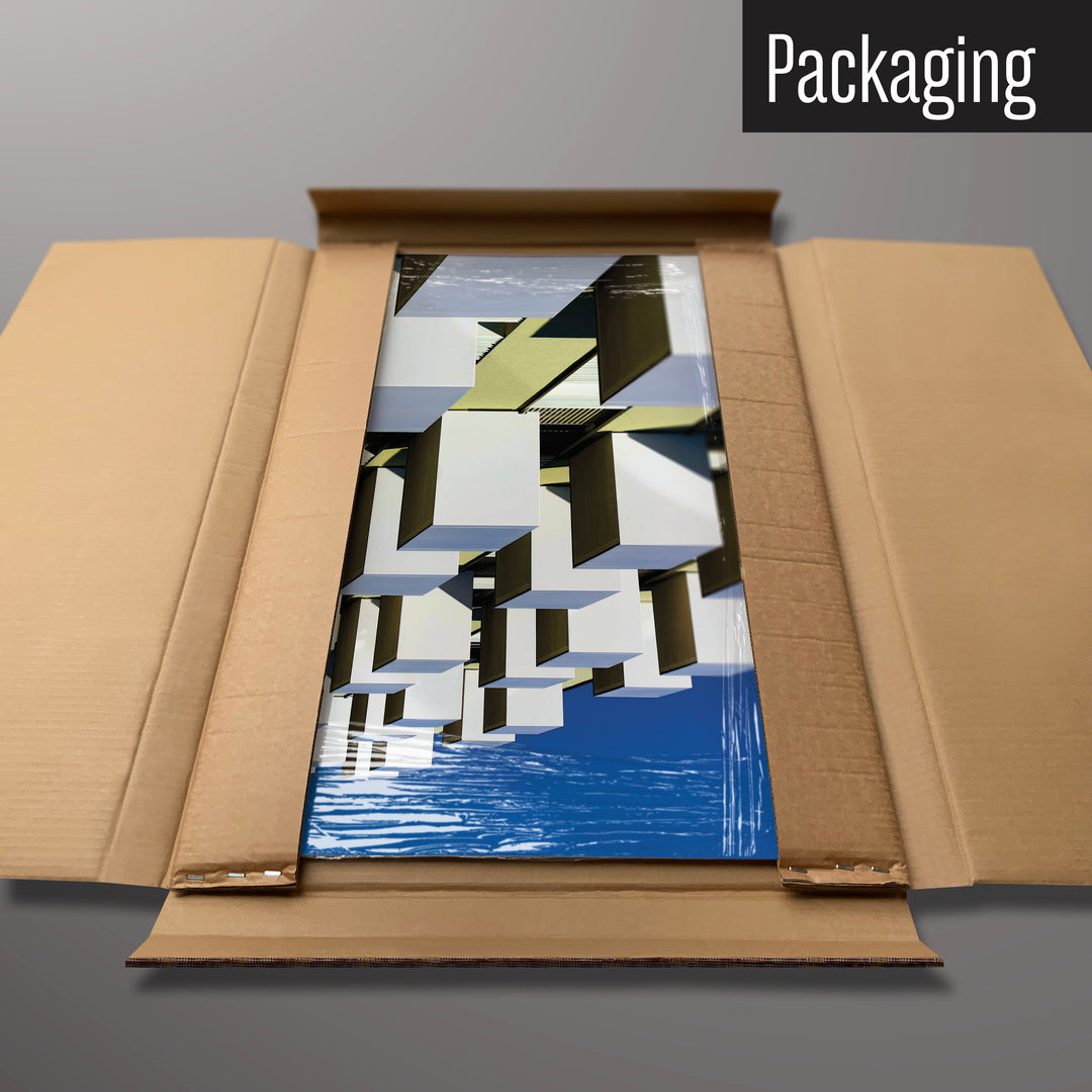 A brutalist balconies photographic magnetic board in it’s cardboard packaging