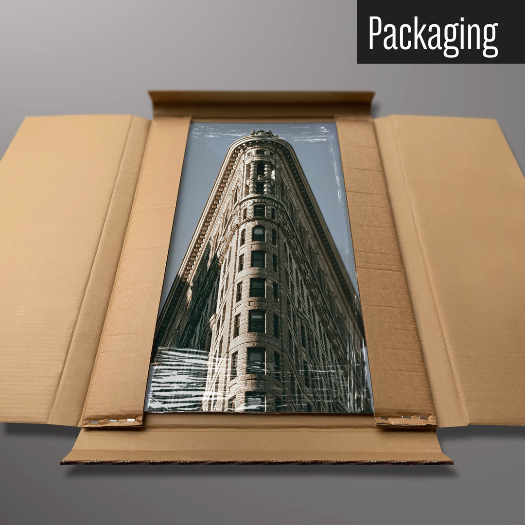 A Flatiron Building magnetic board in it’s cardboard packaging