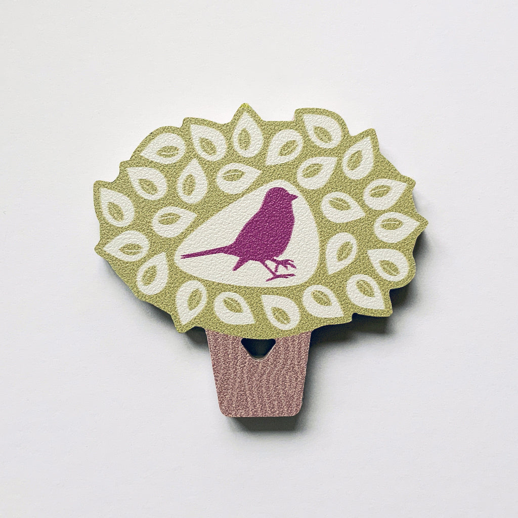 A bird in a tree shaped plywood fridge magnet by Beyond the Fridge