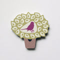 A bird in a tree shaped plywood fridge magnet by Beyond the Fridge
