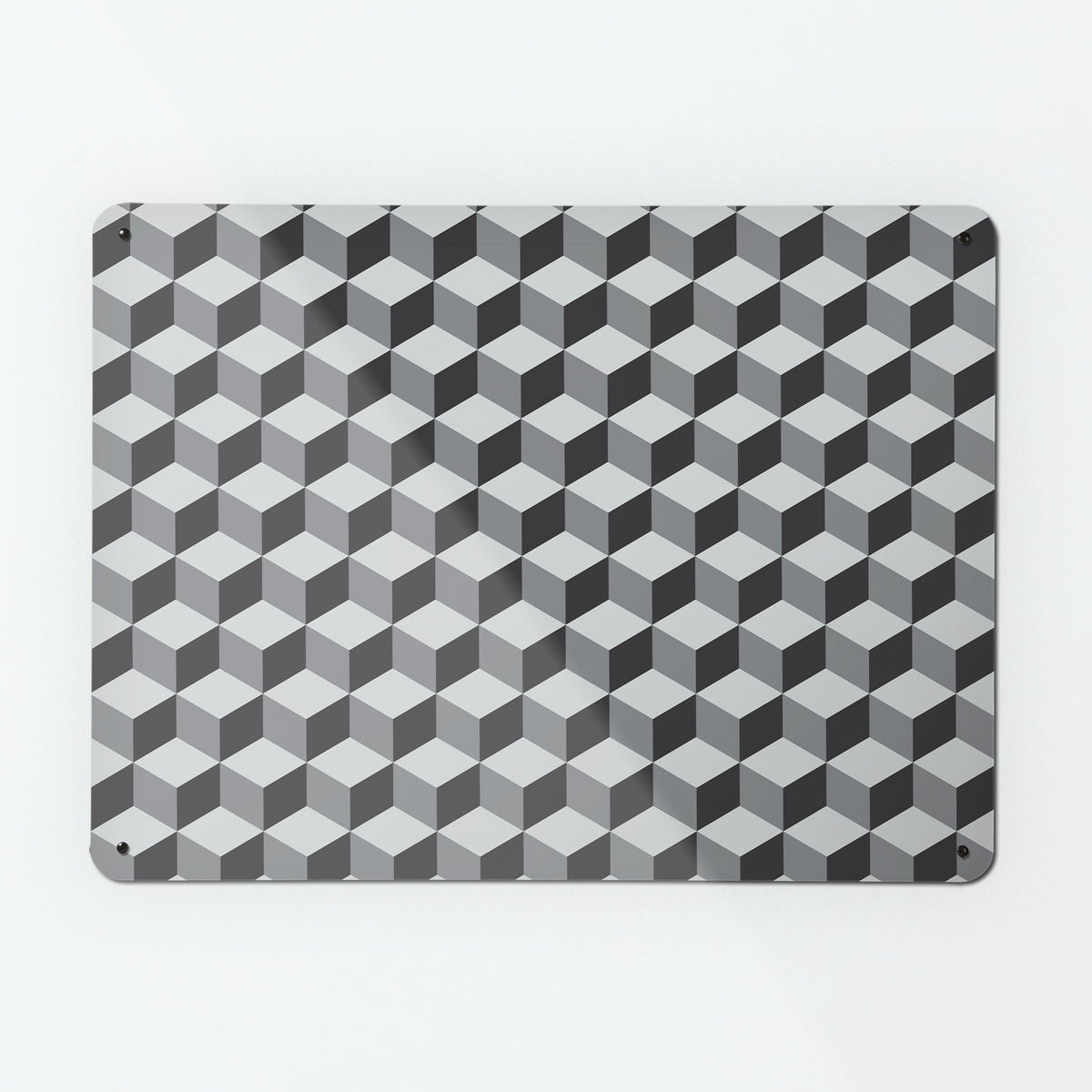 A large magnetic notice board by Beyond the Fridge with a geometric blocks design in shades of grey