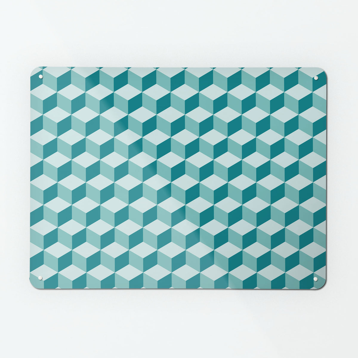 A large magnetic notice board by Beyond the Fridge with a geometric blocks design in shades of teal