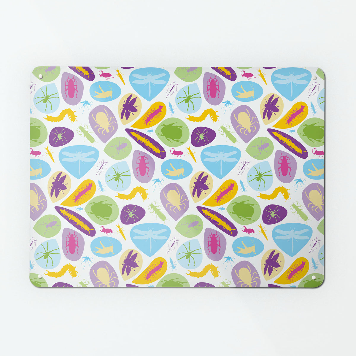 A large magnetic notice board by Beyond the Fridge with a bugs design in bright colours