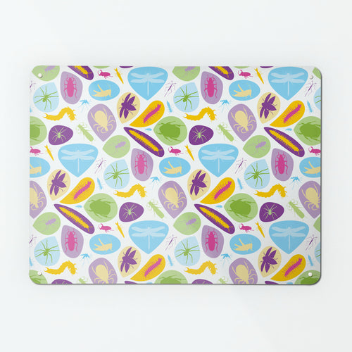A large magnetic notice board by Beyond the Fridge with a bugs design in bright colours