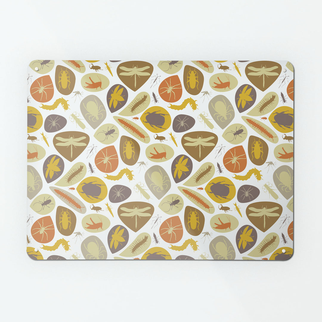 A large magnetic notice board by Beyond the Fridge with an image of bugs design in earthy colours