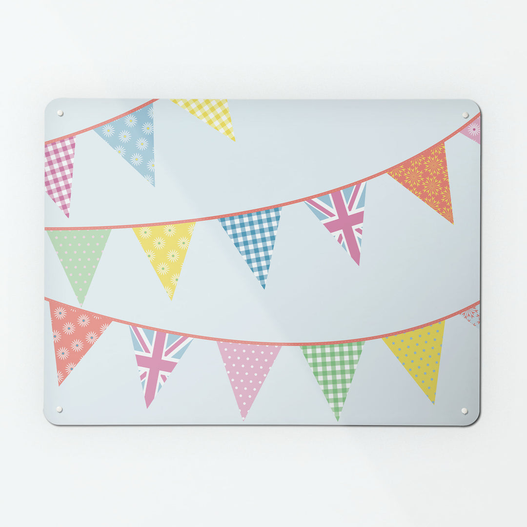 A large magnetic notice board by Beyond the Fridge with a bunting design in pastel colours ion a pale blue background