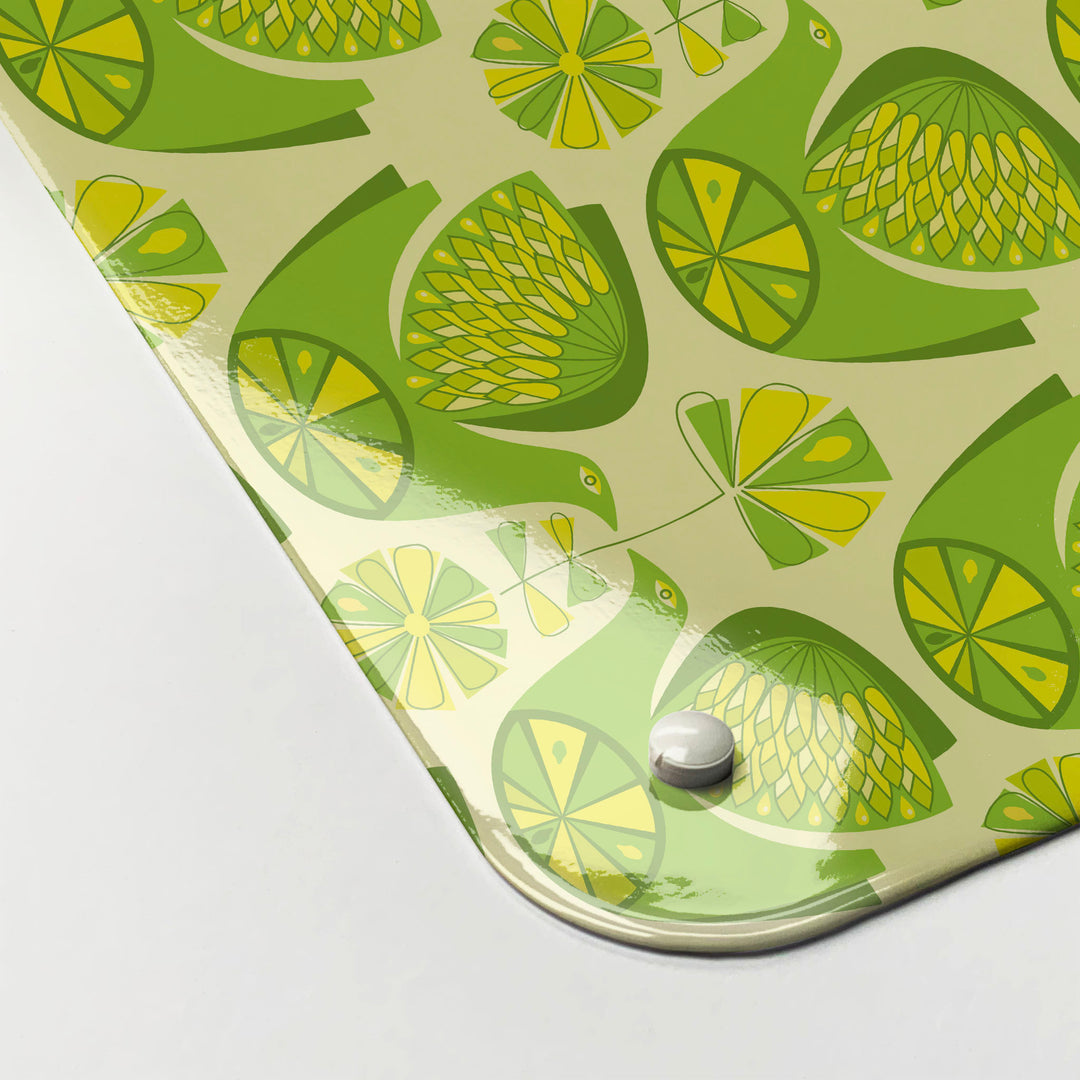 The corner detail of a retro citrus bird lemon and lime magnetic board to show it’s high gloss surface 