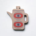 A grey coffee pot shaped plywood fridge magnet by Beyond the Fridge