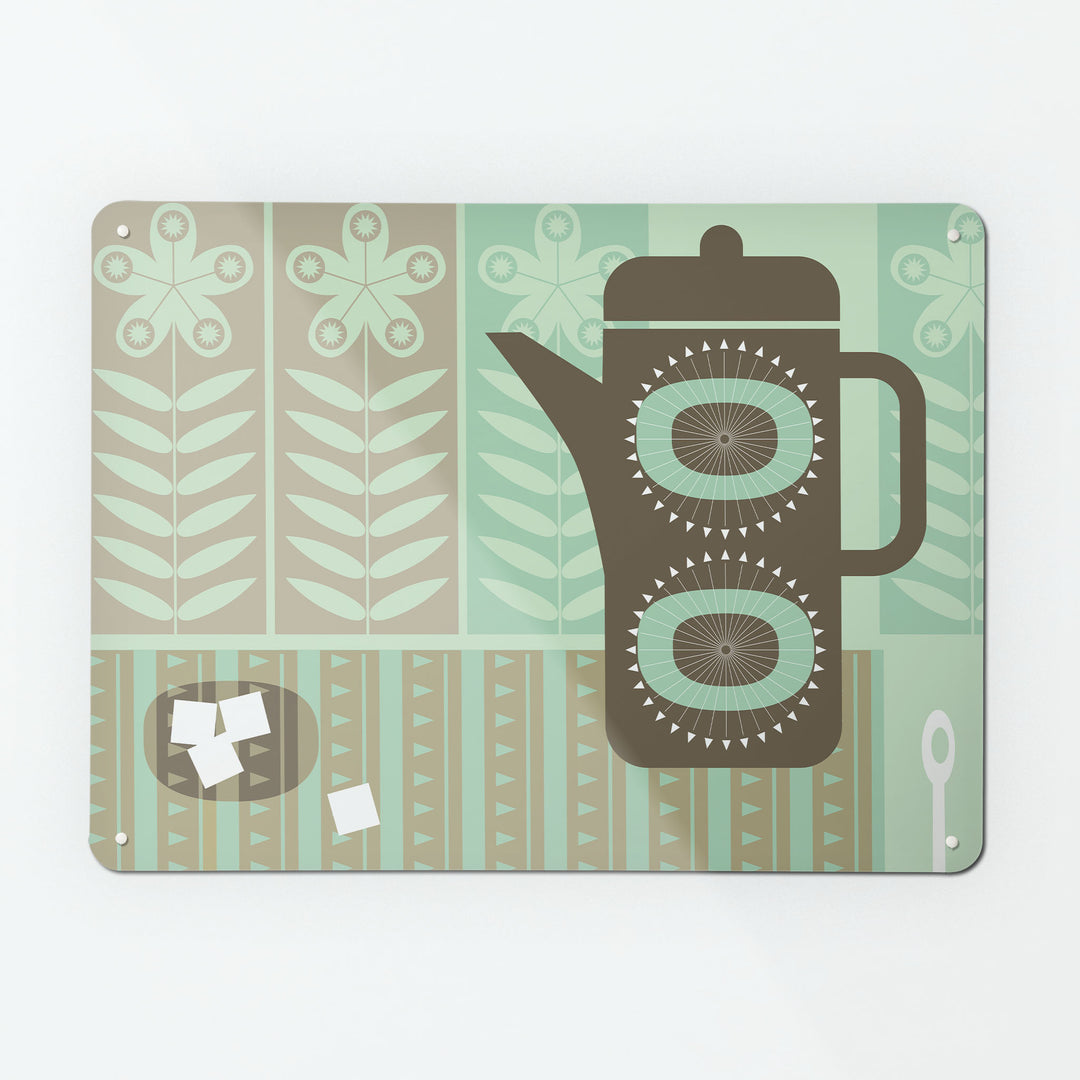 A large magnetic notice board by Beyond the Fridge with a retro coffee pot design in neutral tones of green and brown