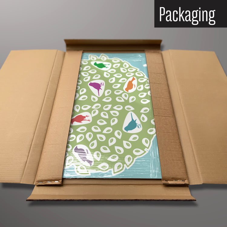 A coloured birds in a tree design magnetic board in it’s cardboard packaging