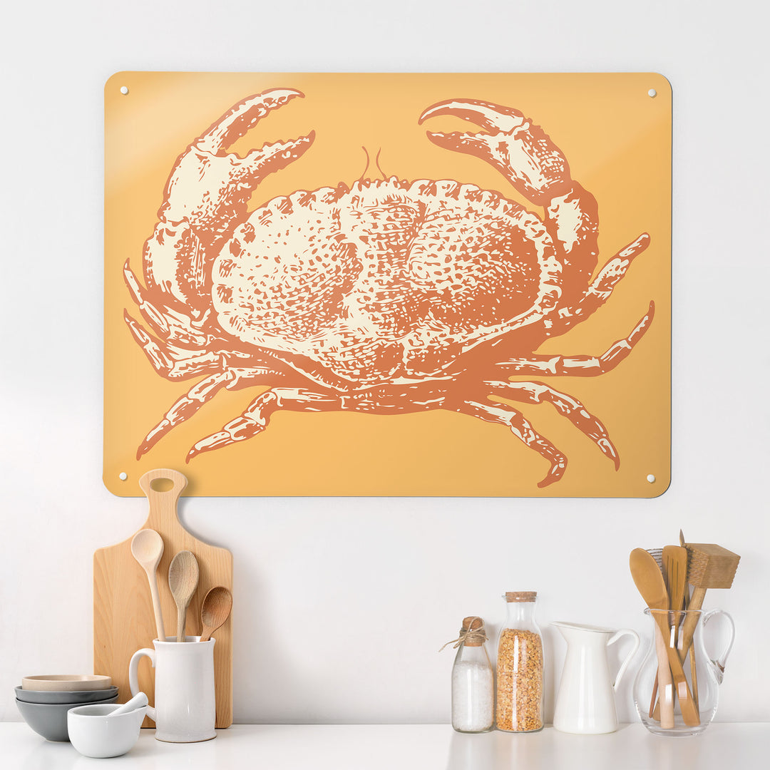 A kitchen  interior with a magnetic metal wall art panel showing a crab illustration in orange