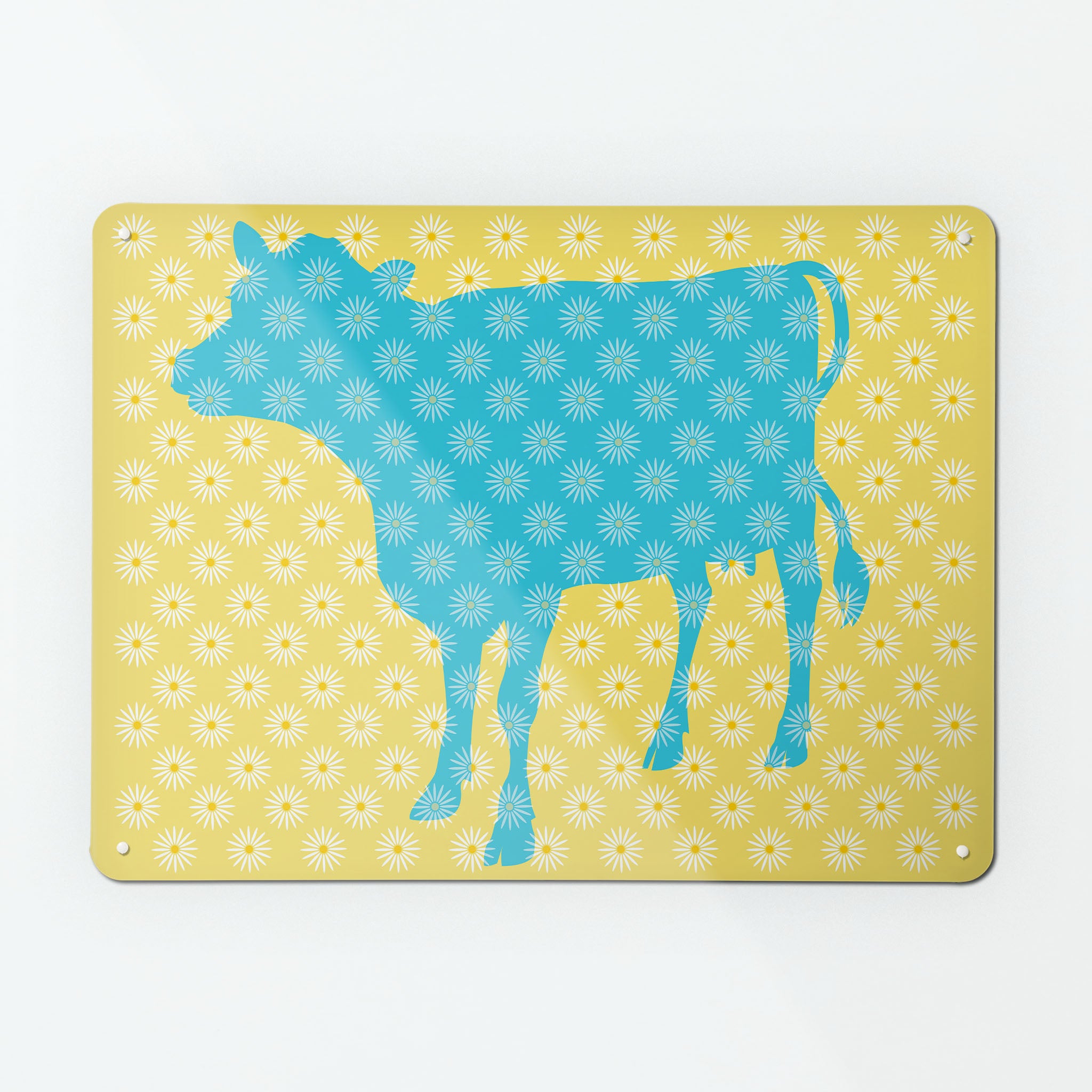 A large magnetic notice board by Beyond the Fridge with a daisy the cow design in blue, white and yellow