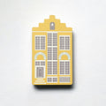 A yellow Delft house shaped plywood fridge magnet by Beyond the Fridge