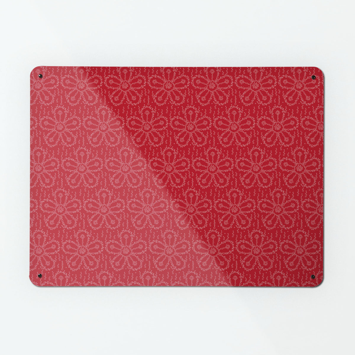 A large magnetic notice board by Beyond the Fridge with a fizzy flower pattern in cherryade colour