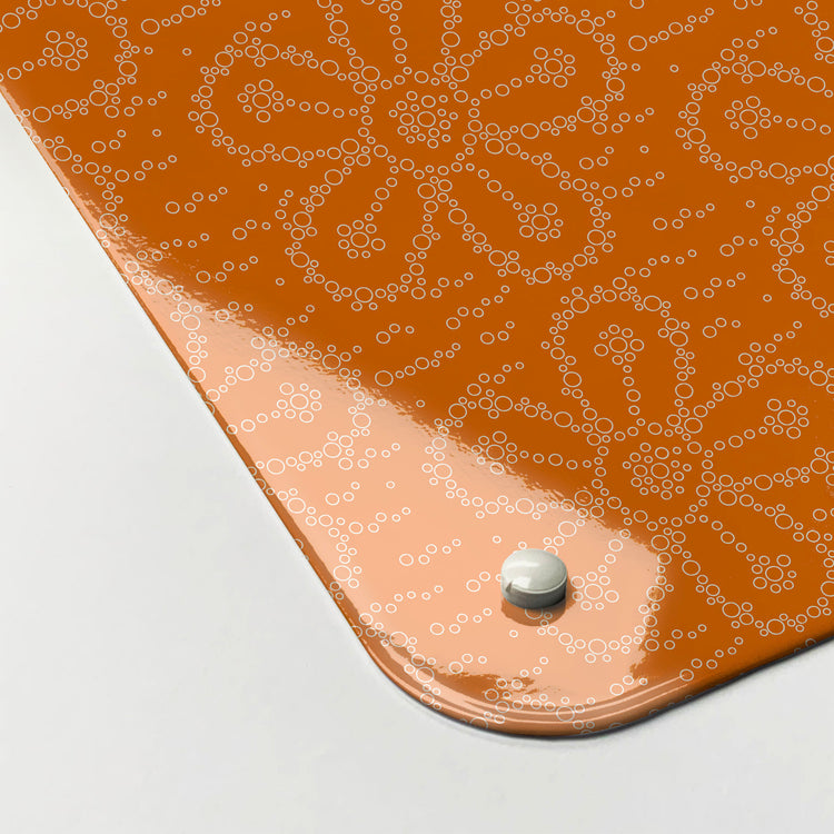 The corner detail of a fizzy flower orangeade design magnetic board to show it’s high gloss surface