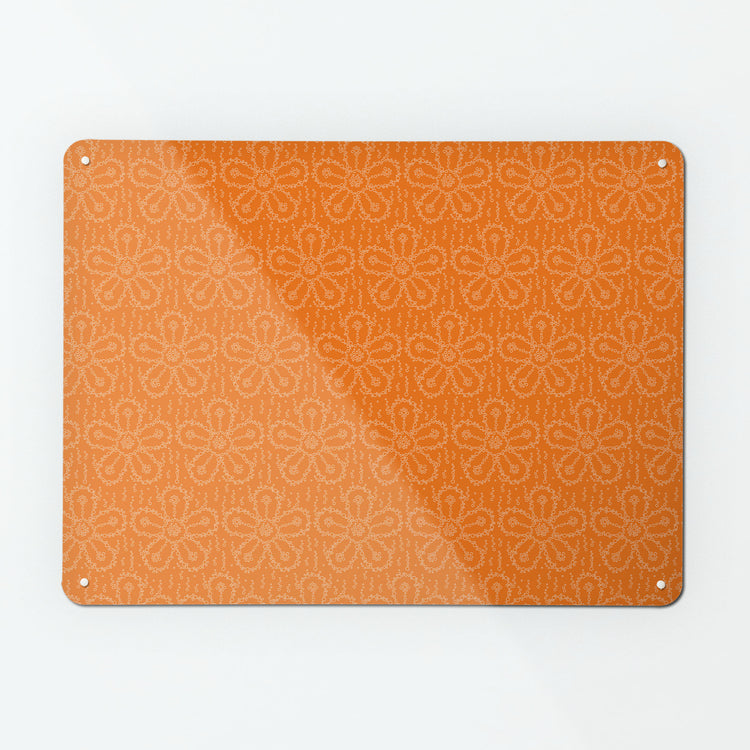 A large magnetic notice board by Beyond the Fridge with a fizzy flower pattern in orangeade colour