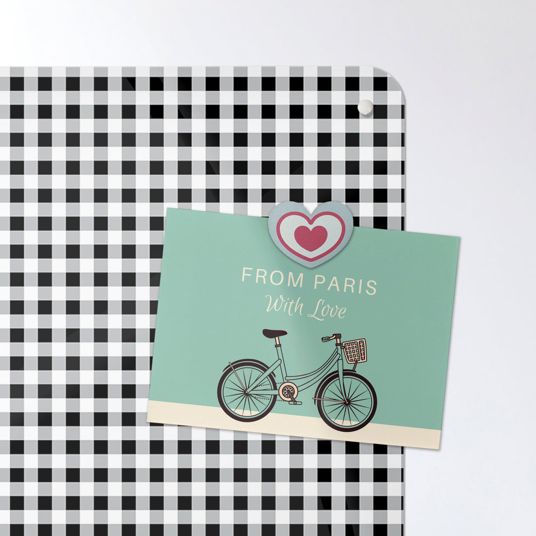 A postcard on a black and white gingham design  magnetic board or metal wall art panel