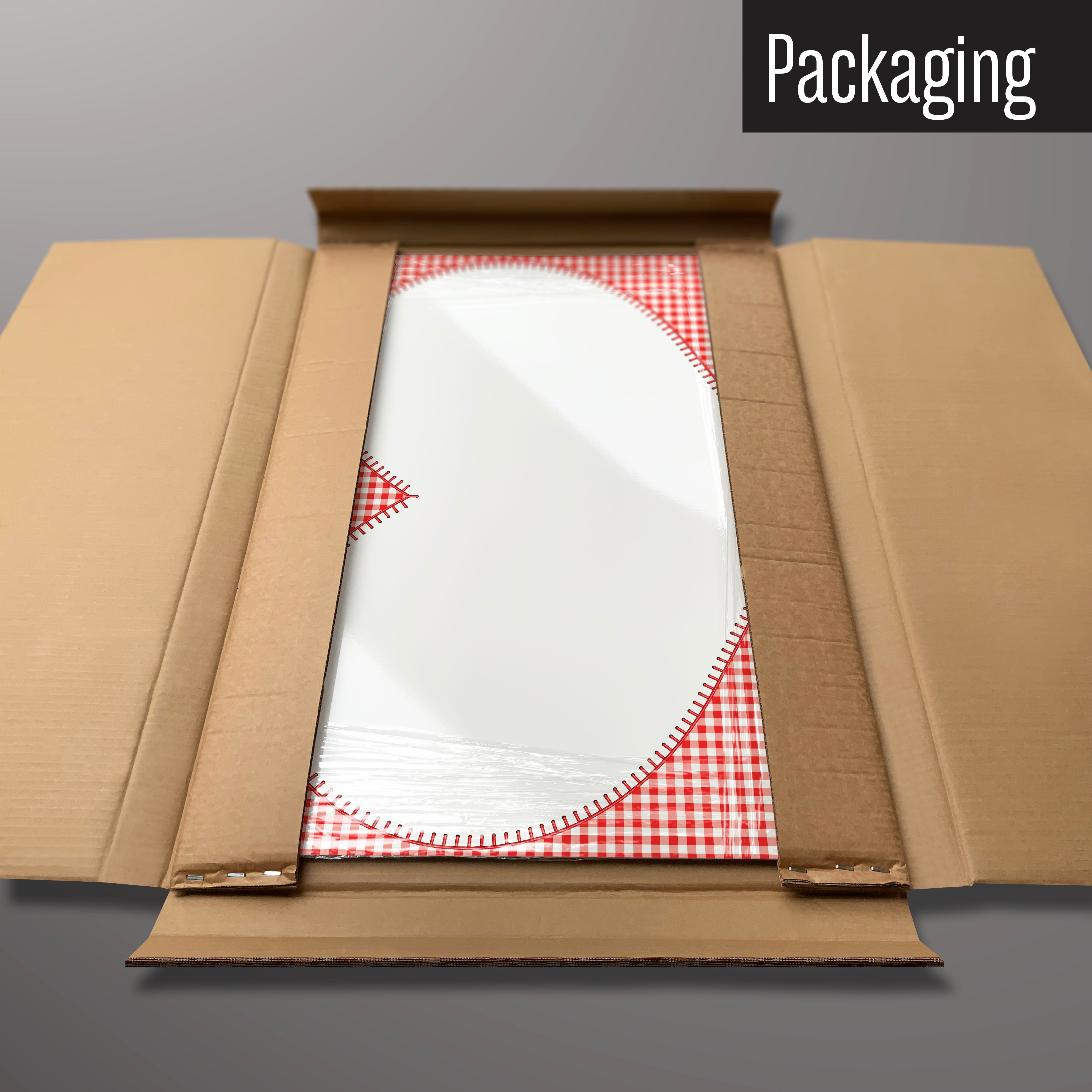A gingham heart design magnetic board in it’s cardboard packaging