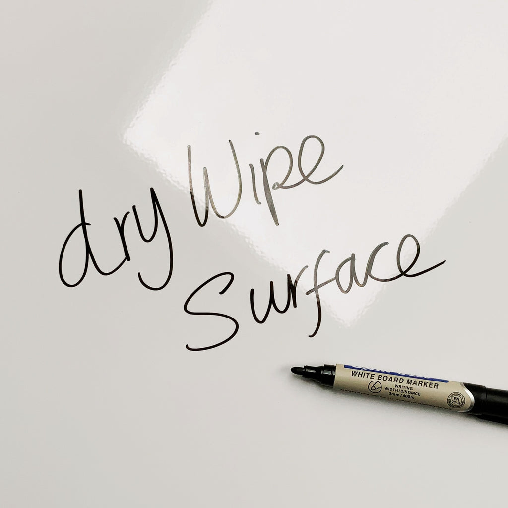 The words dry wipe surface written in marker pen on the Golden Retriever Puppy magnetic notice board