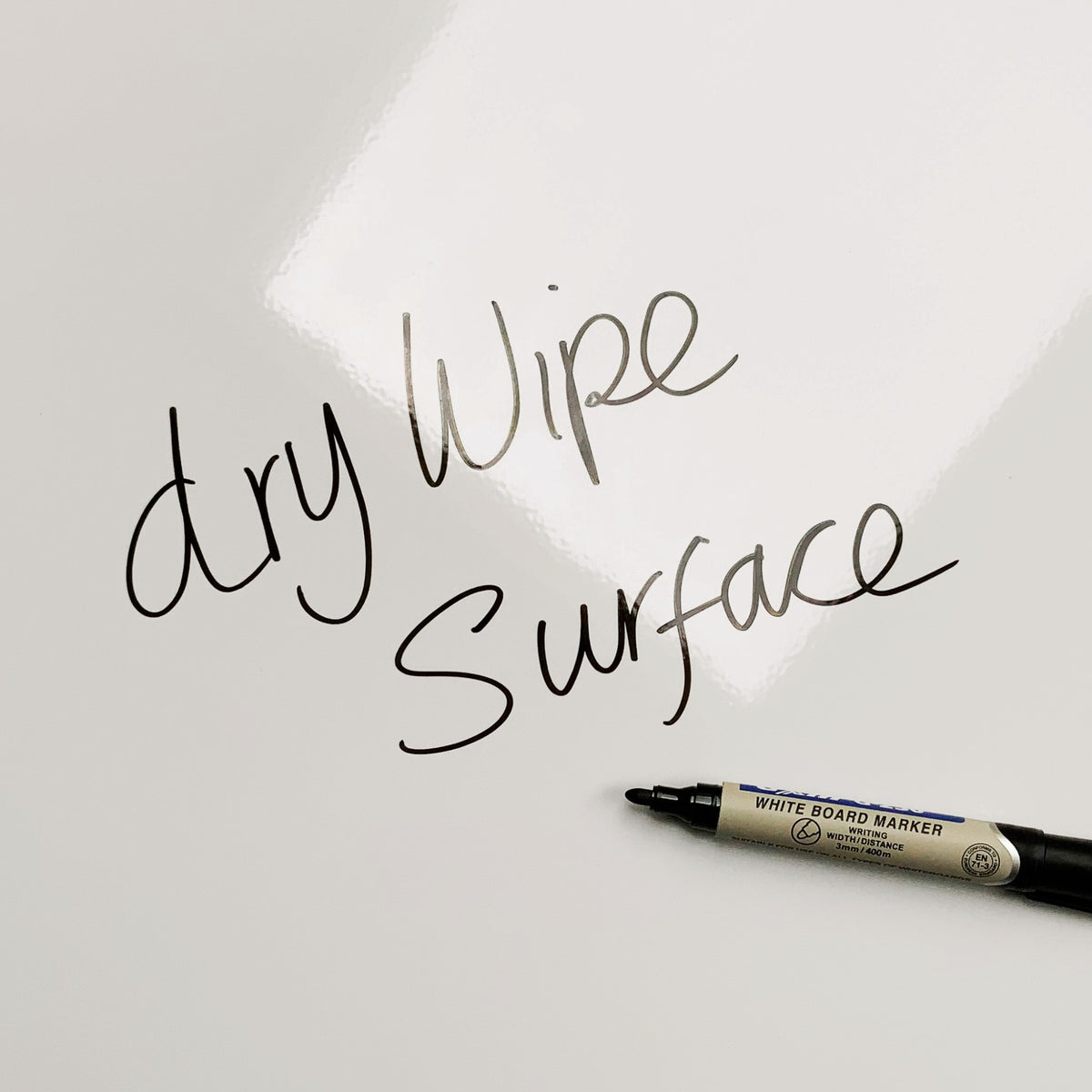 The words dry wipe surface written in marker pen on the Golden Retriever Puppy magnetic notice board