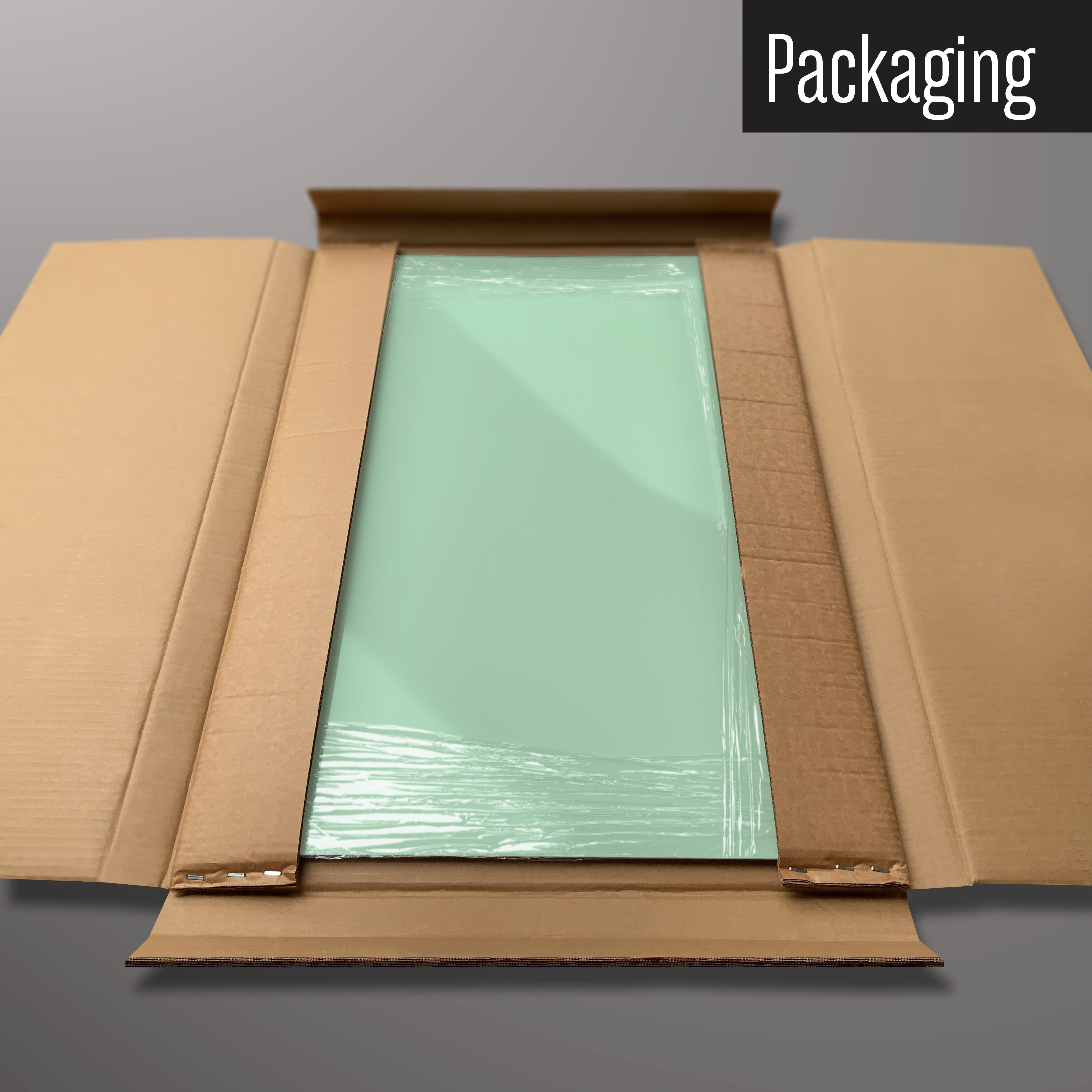 A plain green magnetic board in it’s cardboard packaging