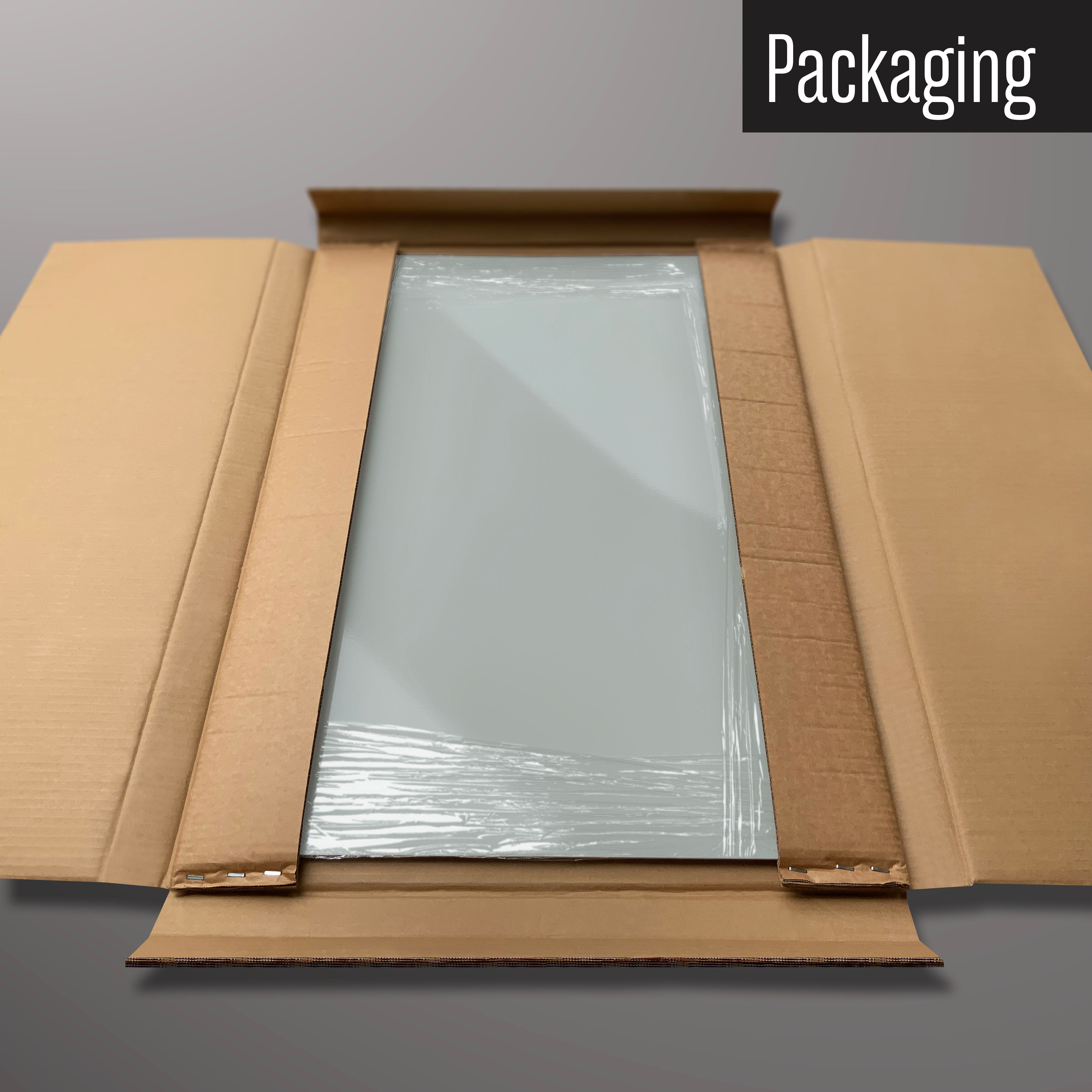 A plain grey magnetic board in it’s cardboard packaging